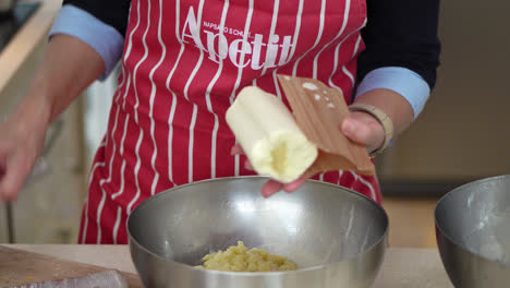 Woman-Adds-Bryndza-In-A-Mixing-Bowl