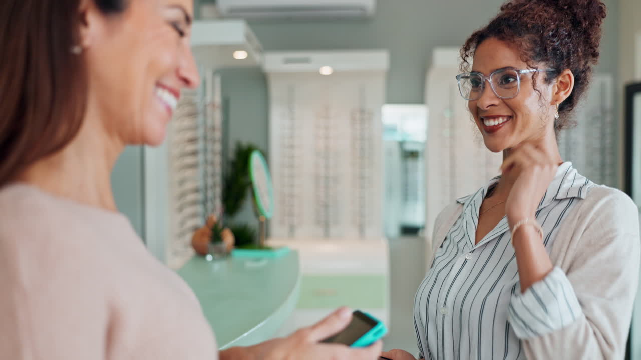 Woman trying on eyeglasses at an optical store