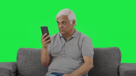 Angry-Indian-old-man-shouting-on-video-call-Green-screen