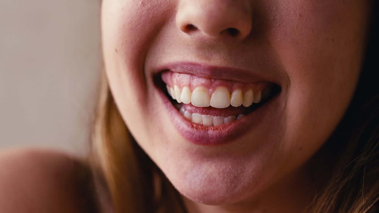Studio Close Up Shot Of Laughing Woman's Mouth Promoting Body Positivity