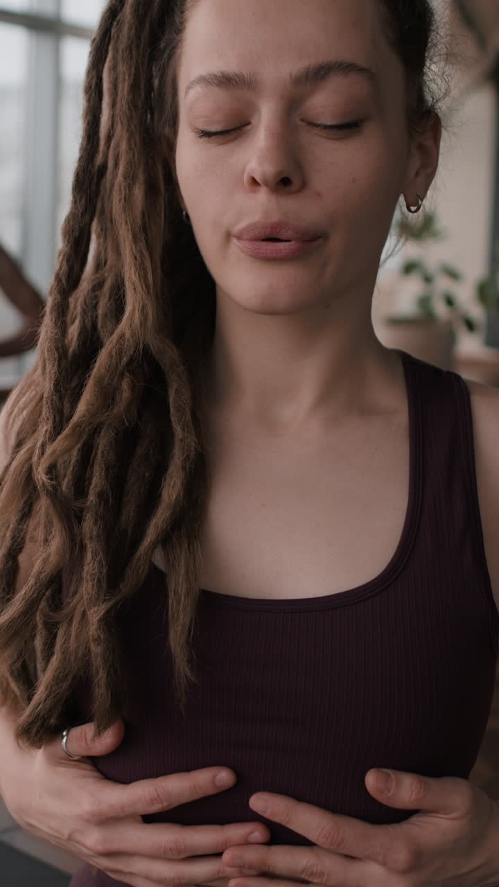 Woman in Yoga Pose Focusing on Breath