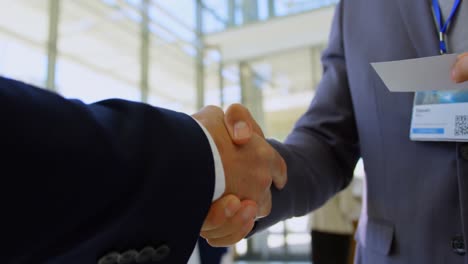 multi ethnic business people shaking hands with each other during a seminar 4k