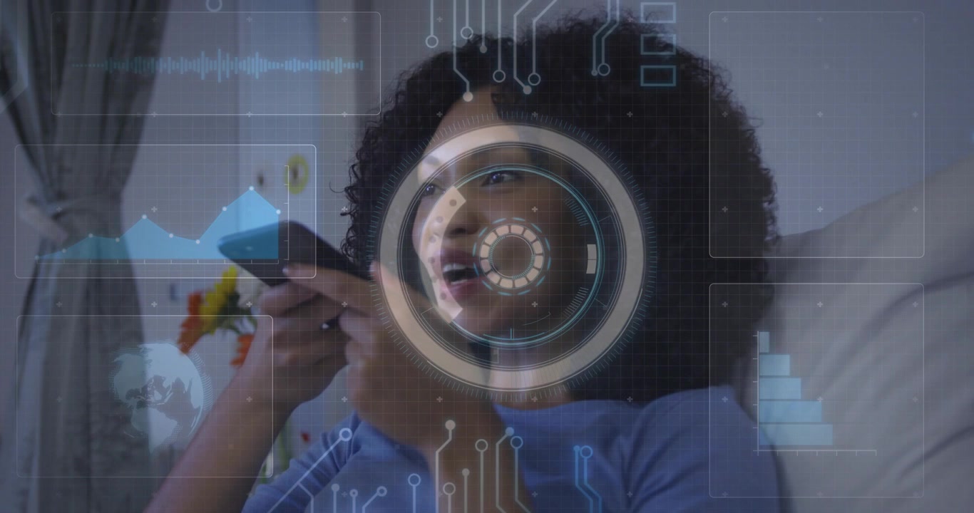 Smiling woman in light blue top holding smartphone near mouth in home living room, HUD overlay