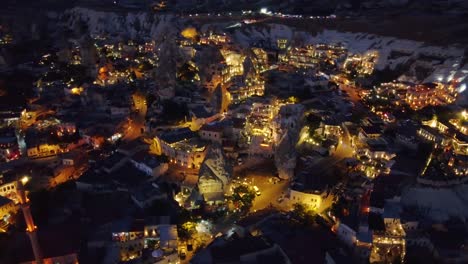 aerial shot of city in cappadocia during night, many lights of the houses