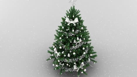 animation of snow falling over christmas tree on white background