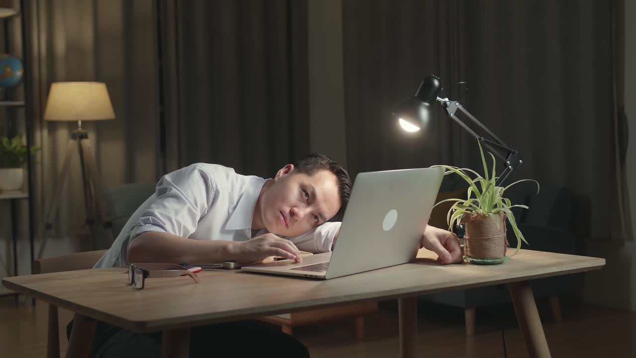 Tired Man Working Late at Night