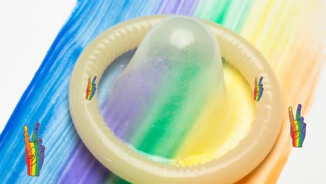 animation of rainbow victory and pride over condom on rainbow background