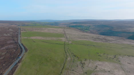 North-York-Moors-Roman-Road,-between-Stape-and-Egton,-ancient-trackway-trod,-history,-aerial-drone-pull-back-along-path-of-track-mavic-3-Cine-prores-422-Clip-2