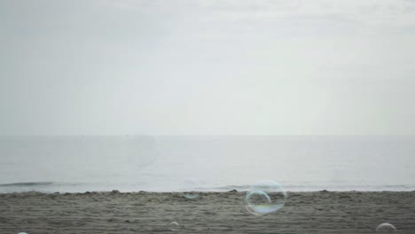 Bubbles Flying And Floating Over The Horizon Of Beach View Slow-Motion