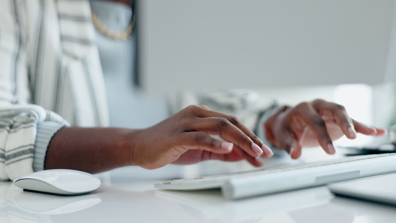Receptionist, typing and hands on keyboard