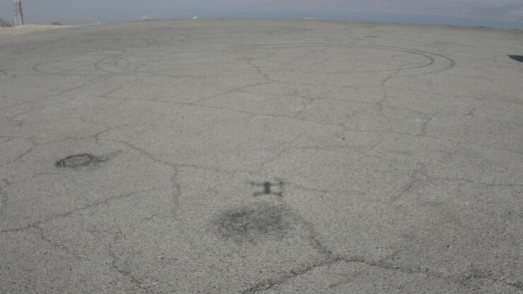 Drone land on a concrete surface shot it's shadow