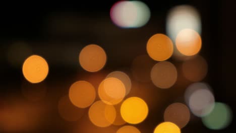 blurred bokeh light spots on black background.