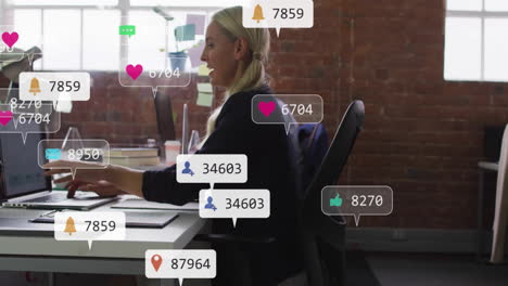 social media notifications animation over woman working at desk in office