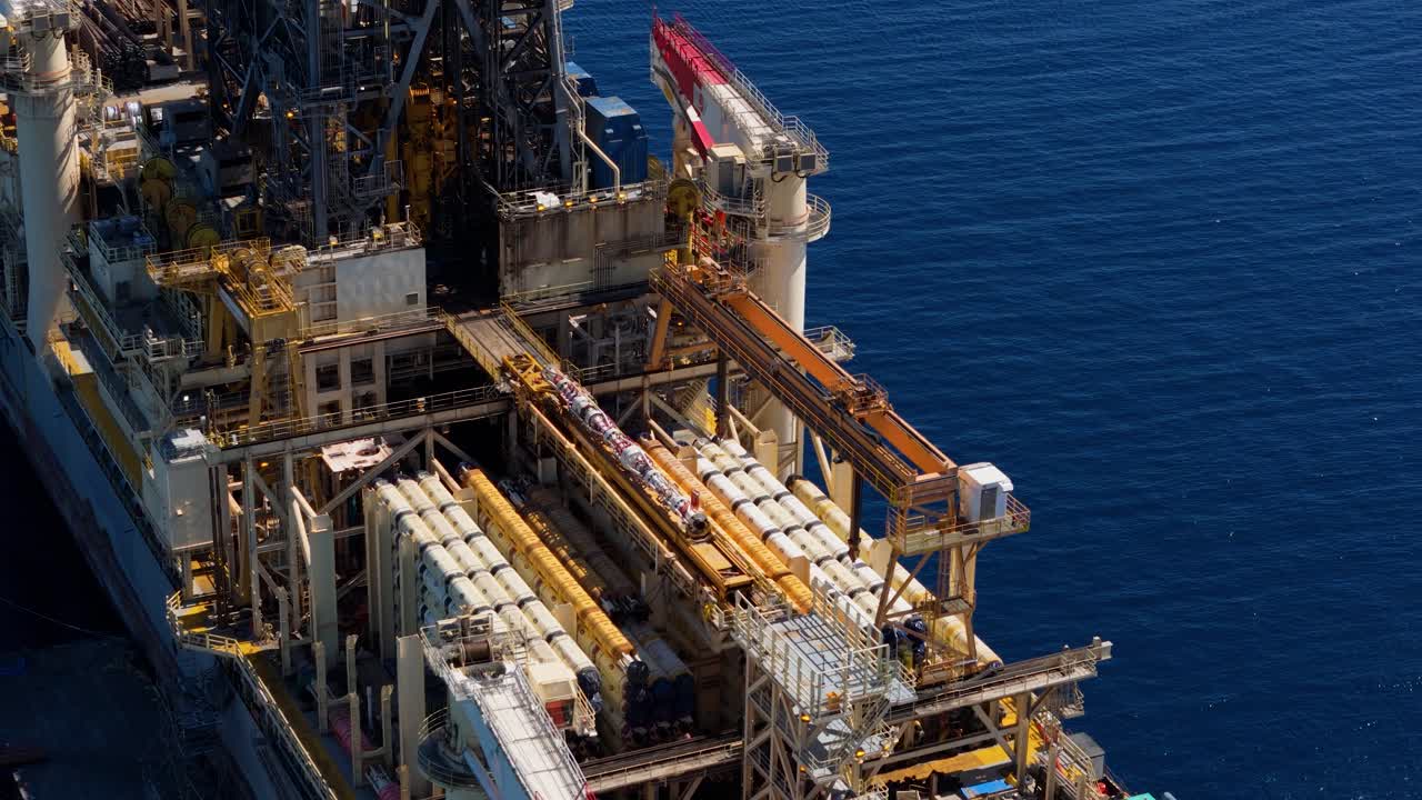 Aerial overview of oil rig platform drilling ship anchored in calm ...