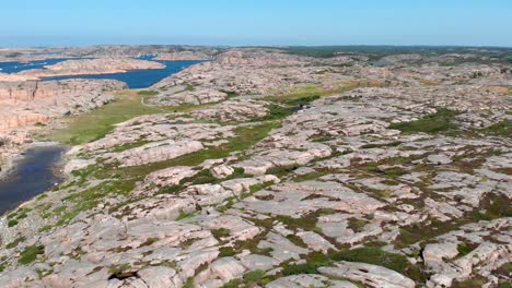 Aerial-View-of-Valon-Nature-Reserve-in-Bohuslan,-Sweden,-Rugged-Rocky-Coastline-on-Sunny-Summer-Day,-Drone-Shot
