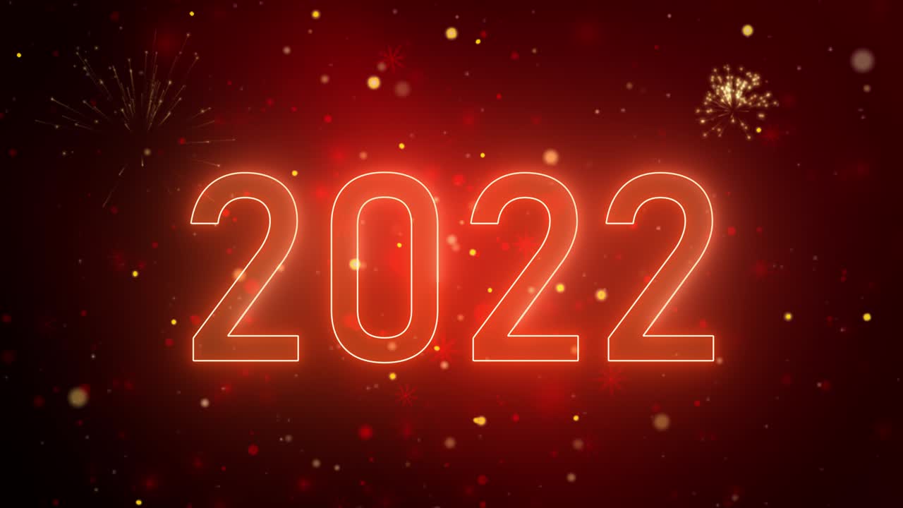 Testo di auguri di buon anno 2022 con particelle di glitter e scintille su sfondo rosso
