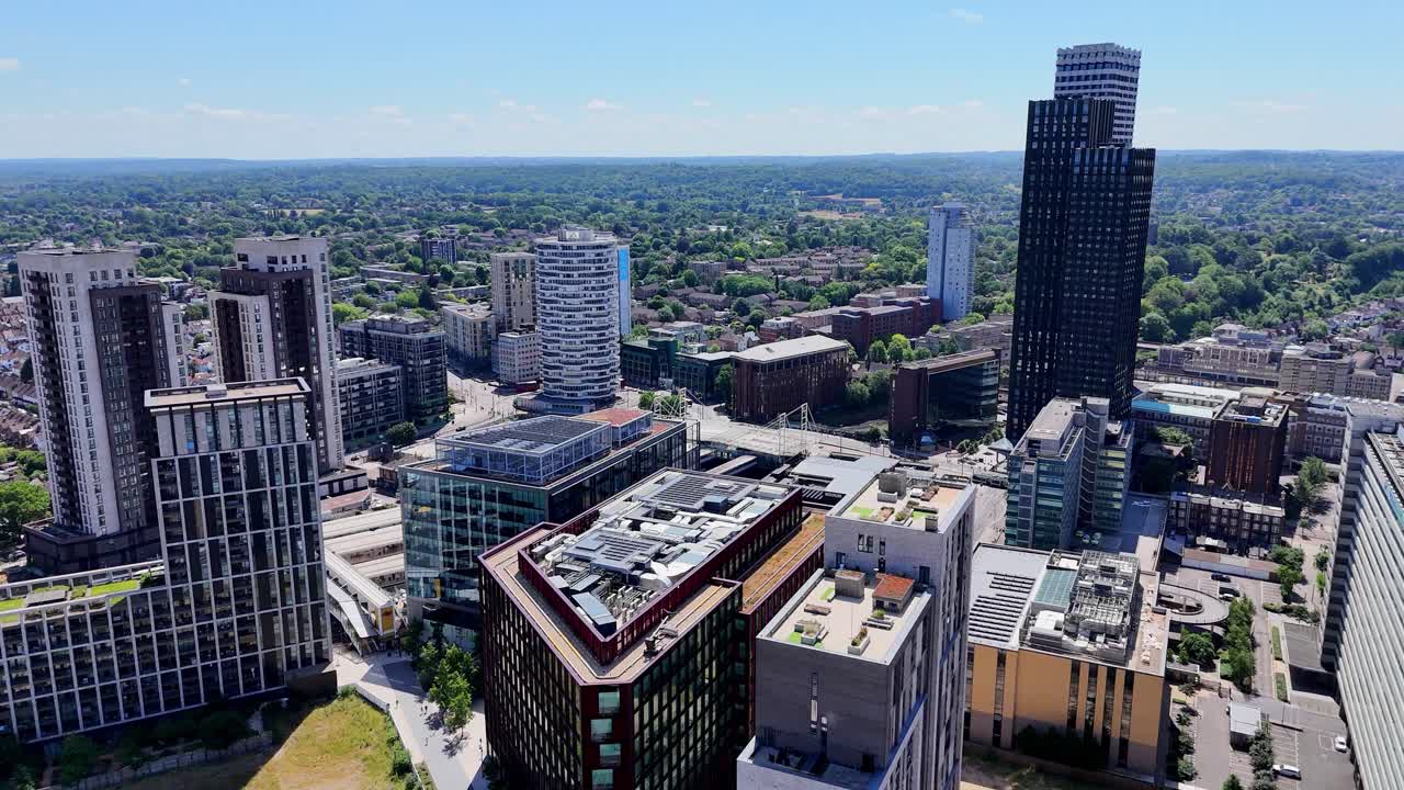 Aerial footage of modern Croydon, London, capturing its striking urban skyline, contemporary high-rises, and the dynamic energy of this evolving cityscape.