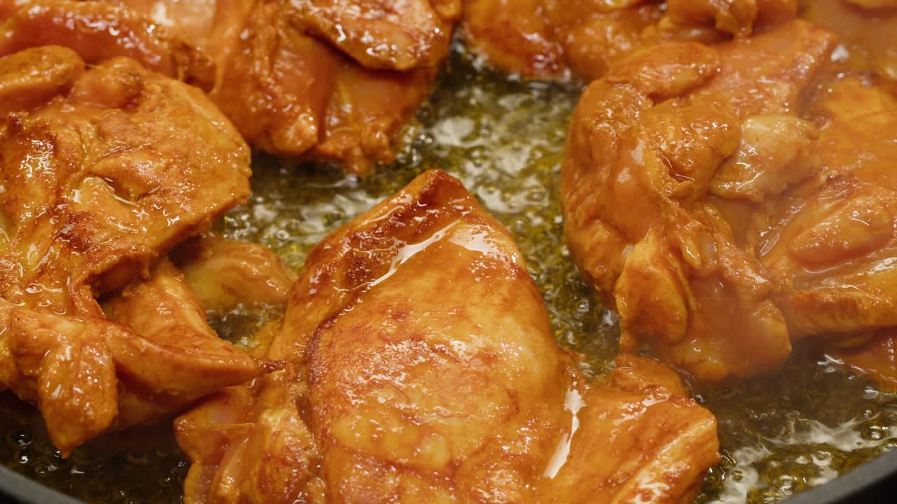 Frying chicken thighs