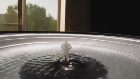 white figure of man standing in hyaluronic acid on speaker