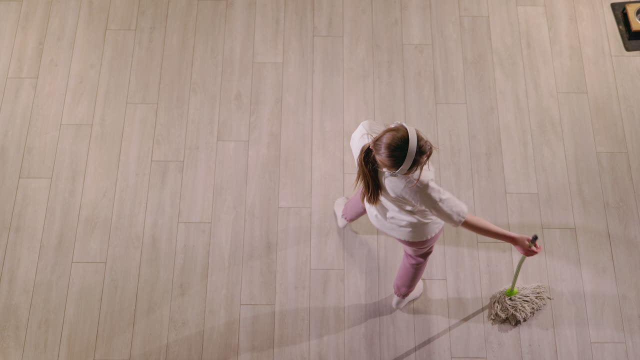 Girl Dancing While Mopping