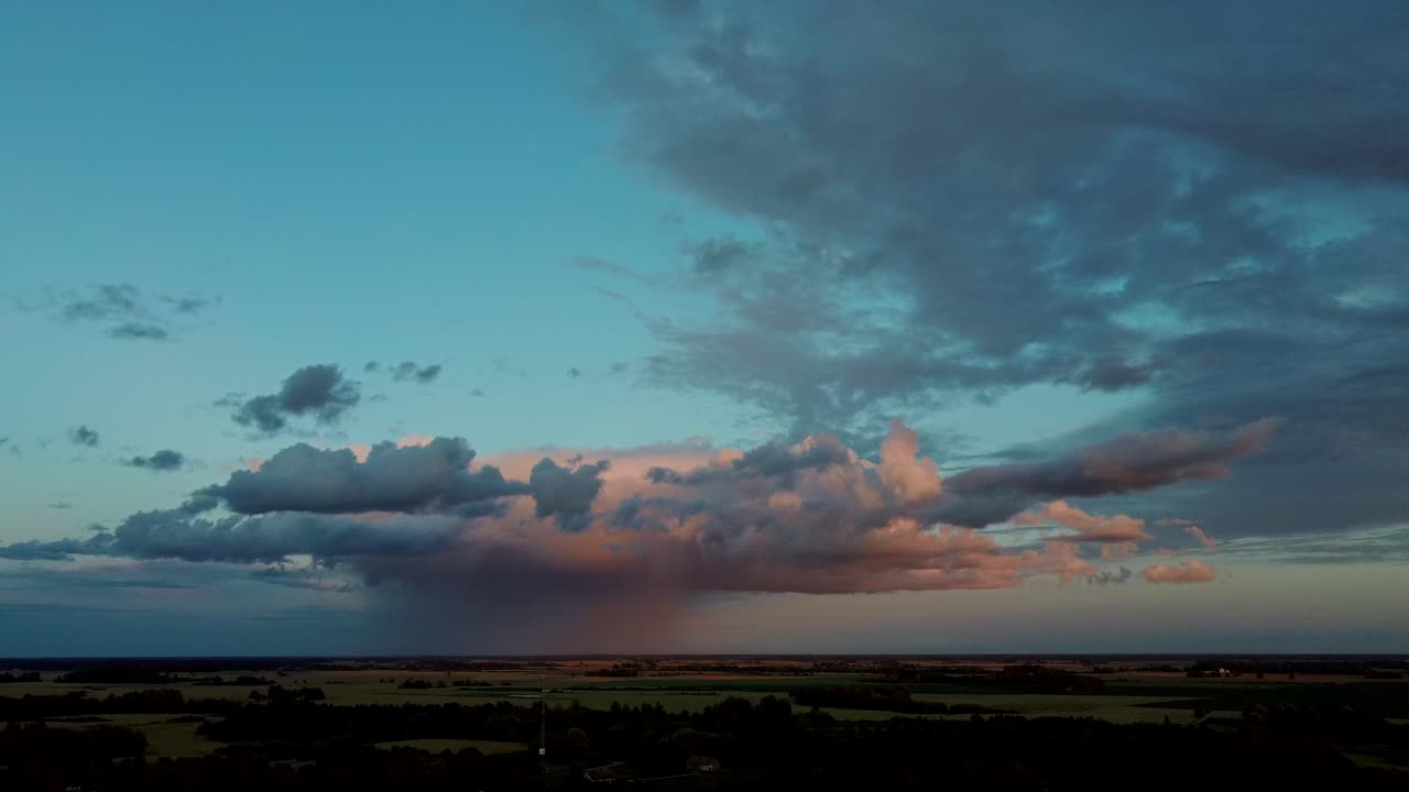 Storm Clouds With the Rain. Nature Environment Tornado Warned Supercell Storm Rolling Through the Plains. Crop Field After Rain and Storm Clouds in Background Rural Countryside. Aerial Dron Shot