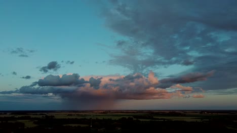storm clouds with the rain. nature environment tornado warned supercell storm rolling through the plains. crop field after rain and storm clouds in background rural countryside. aerial dron shot