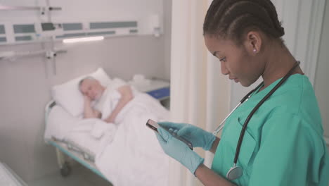 a beautiful young american nurse texting on her phone