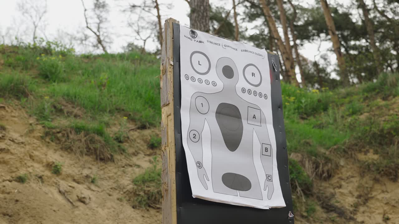 Low angle view of paper target with human silhouette at Olesko shooting range