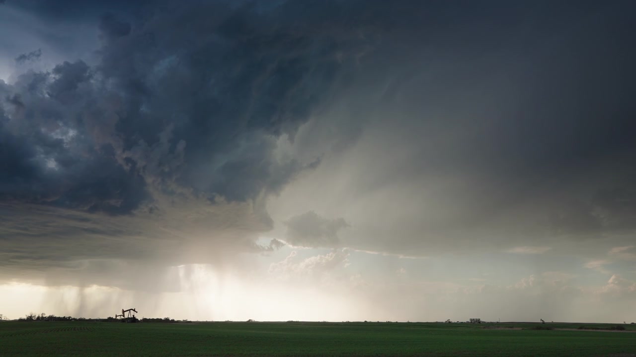 Spinning supercell thunderstorm clouds roll through nature in 4K timelapse