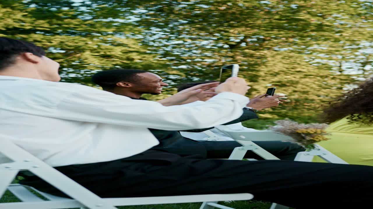 People at a wedding taking pictures