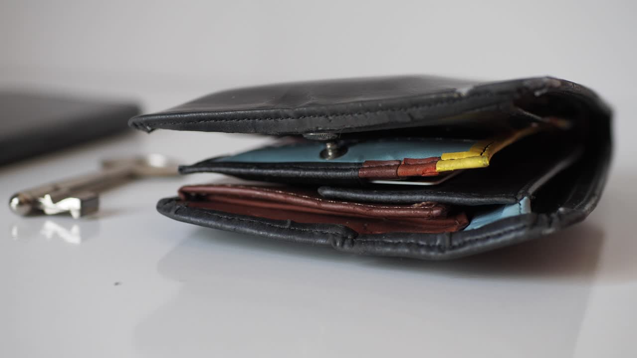 Close-up of a Black Leather Wallet with Keys