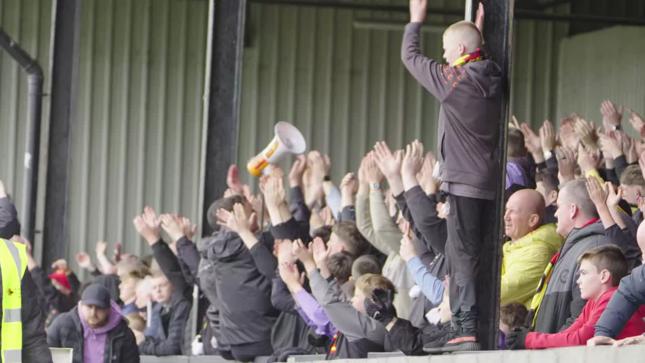 Hands collide, thunderous sound, echoing love from all around