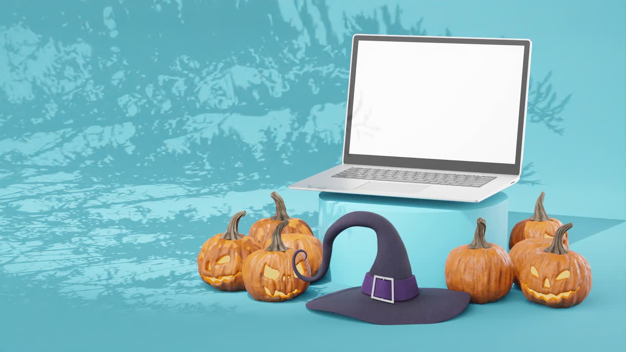 Abóboras esculpidas para o Halloween com laptop de tela branca em branco