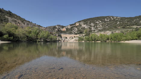 calm shallow water with rocks at le pont du diable herault south of france sunny