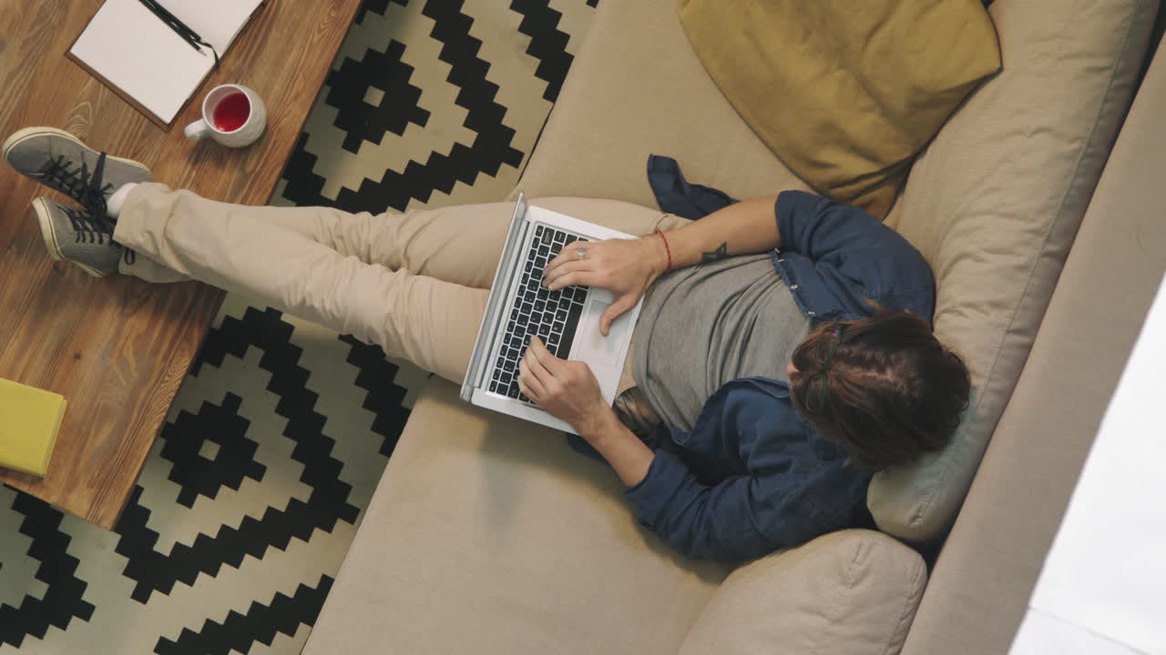 Top View of Man Working on Laptop