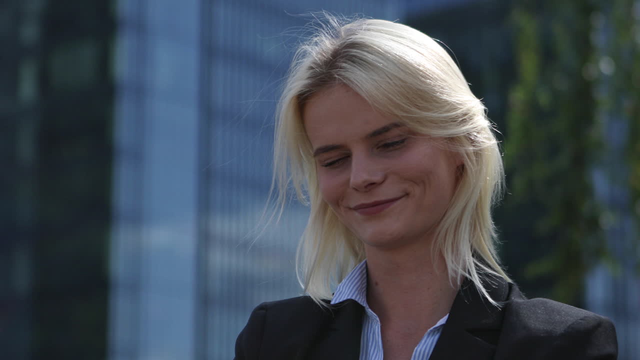 Portrait of a businesswoman against the background of office buildings