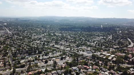 drone panorama of luxury city in near los angeles. sunny day with trees along street in hidden hills, usa. wide shot.