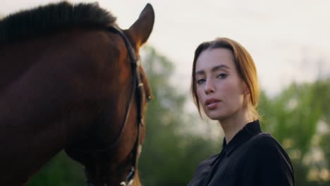 woman and horse at sunset