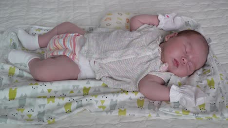 baby girl sleeping peacefully in the crib - close up