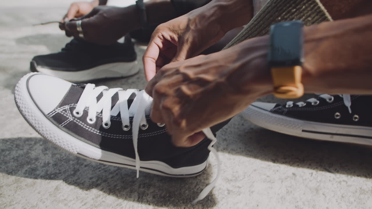Streetball Players Chatting when Tying Shoelaces