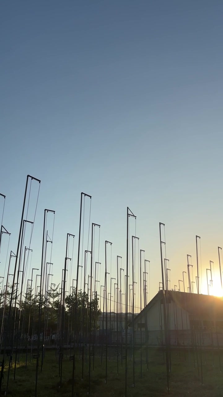 Sunset View of Metal Pole Installation in a Park