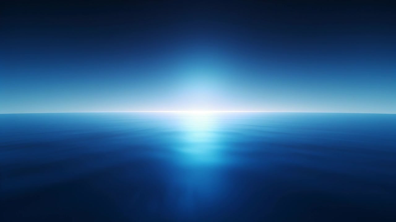 Brightening central horizon light expanding after rise, casting vertical glow and mirror on ocean