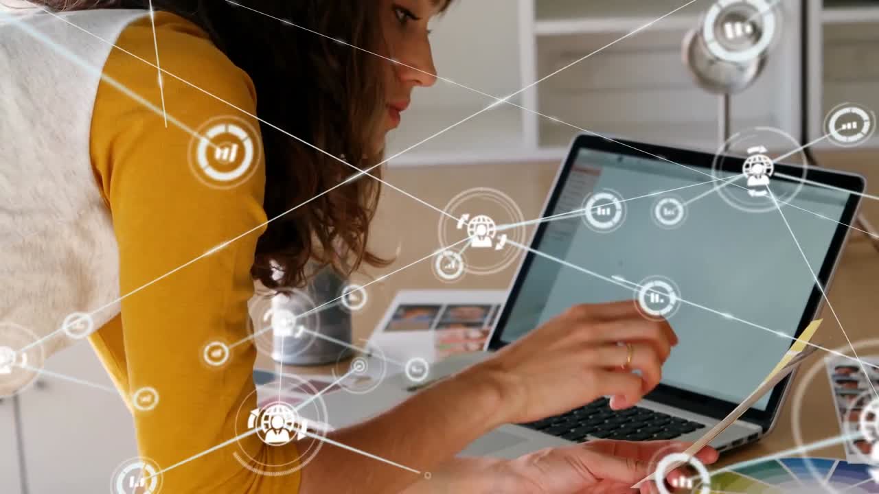 animación de una red de conexiones con iconos sobre una mujer de negocios caucásica usando una computadora portátil
