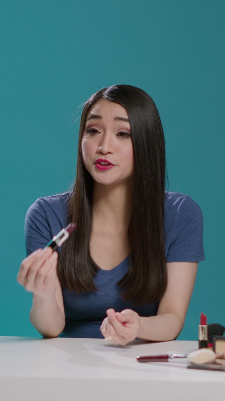 Beauty Vlogger Holding Lipstick