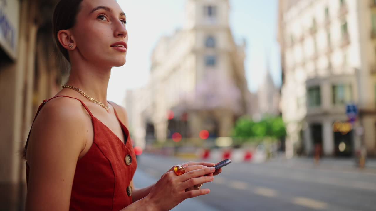 Woman with Smartphone in City