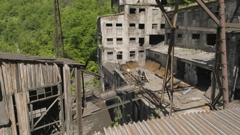 desolate concrete buildings of abandoned mining factory, georgia