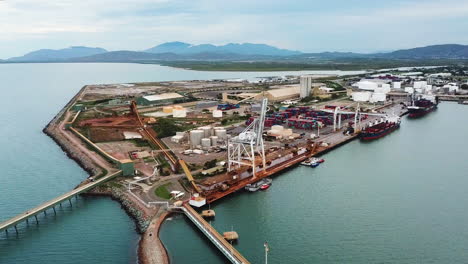 drone footage slowly circling marine port facilities in townsville, australia