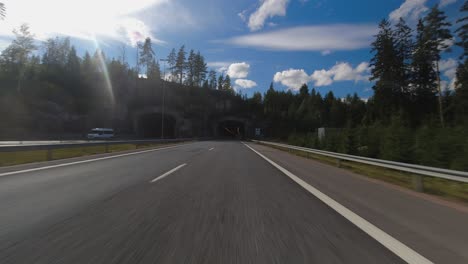 day time hyperlapse pov: driving on country highway through tunnels