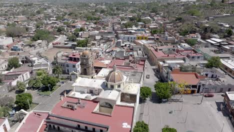 amatitan municipality in the mexican state of jalisco, home to world's largest tequila distilleries, la hacienda de san jose del refugio, temple of amatitan in view, drone shot