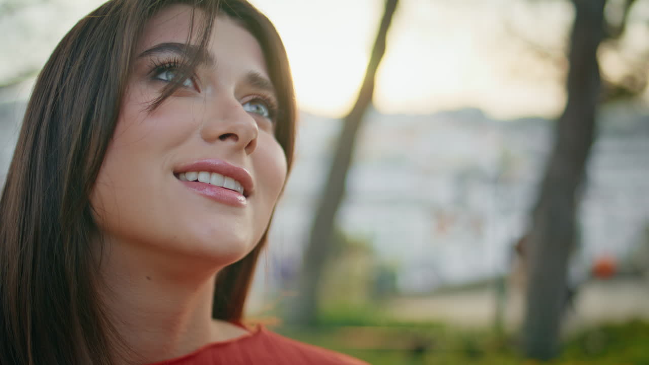 Romantic woman portrait posing green quiet park looking mysteriously in camera